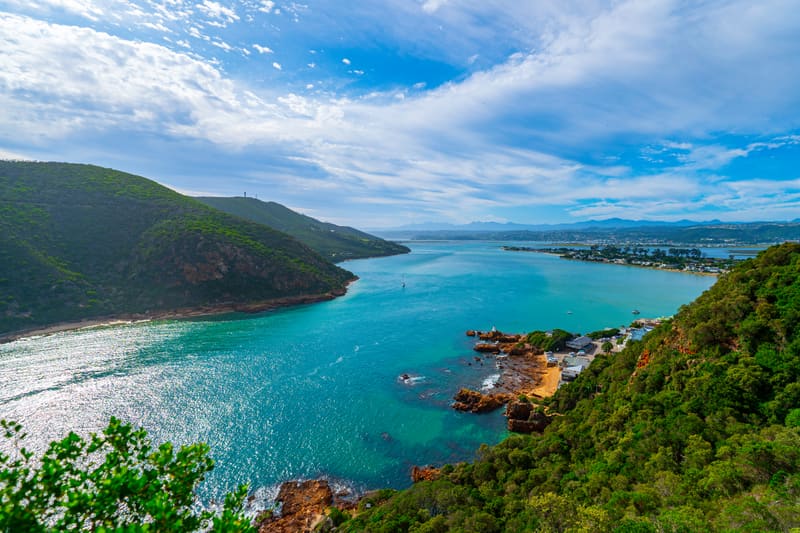 The Knysna Heads, with the lagoon opening to the sea between forested headlands.